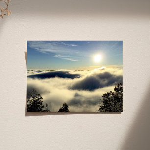 Sun rising above the clouds over Colorado Springs. Poster