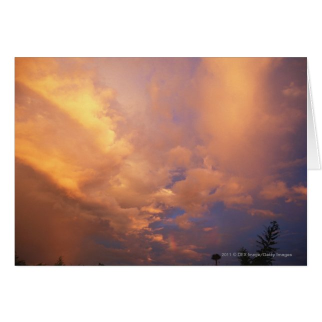 Sun setting behind clouds (Front Horizontal)