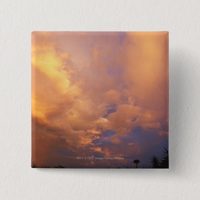 Sun setting behind clouds 15 cm square badge (Front)
