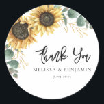 Sunflower Eucalyptus Wedding Script Thank You Classic Round Sticker<br><div class="desc">Create a modern Sunflower Floral thank you favour sticker with this cute template featuring beautiful rustic floral bouquet, geometric gold effect leaves, with modern simple typography. TIP: Matching wedding suite cards like RSVP, wedding programs, banners, tapestry, gift tags, signs, and other wedding keepsakes and goodies are available in the collection...</div>