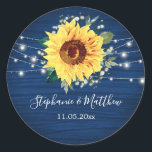 Sunflower Navy Babys Breath Lights Wedding Classic Round Sticker<br><div class="desc">These wedding stickers feature a rustic sunflower, babys breath flowers and string lights on a navy blue wood grain background. Personalise these stickers with your names and wedding date. These stickers are part of a collection which includes matching wedding stationery and gifts. Please visit the collection pages in our store...</div>