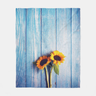 Sunflower on Blue Wood Wall Fleece Blanket