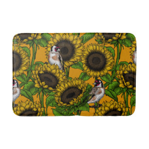 Sunflowers and goldfinches on orange bath mat