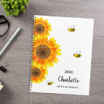 Sunflowers bees name planner<br><div class="desc">Stay organised in style with our Personalised Sunflower and Bee Spiral Planner. Featuring a delightful design of vibrant watercolored sunflowers and cheerful bees on a crisp white background, this planner adds a touch of whimsy and charm to your daily organisation. Charming Sunflowers and Bees: Adorned with three large watercolored sunflowers...</div>