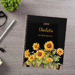 Sunflowers black 2026 planner<br><div class="desc">Embrace your organisational skills with our Personalised Sunflower Garden Spiral Planner. Perfect for staying on top of your schedule with a touch of rustic charm, this planner combines functionality with a beautiful and personalised design. Elegant Black Background: The sophisticated black backdrop provides a striking contrast, making the vibrant watercolor sunflowers...</div>