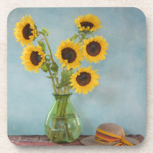 Sunflowers in vase on table coaster