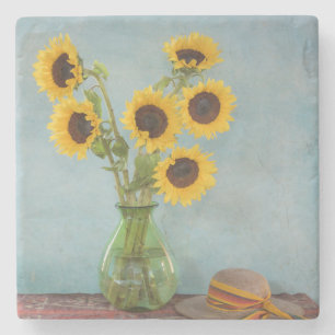 Sunflowers in vase on table stone coaster