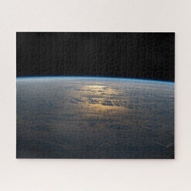 Sunglint Beams Off A Partly Cloudy South Pacific Jigsaw Puzzle (Horizontal)
