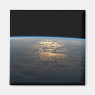 Sunglint Beams Off A Partly Cloudy South Pacific Magnet