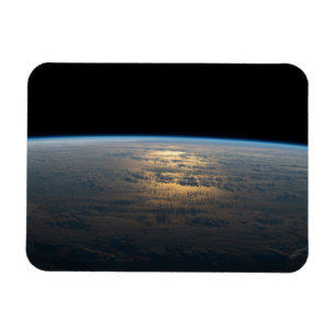 Sunglint Beams Off A Partly Cloudy South Pacific Magnet