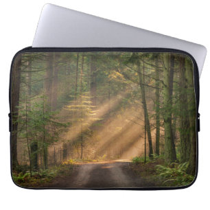 Sunlight Shining Through a Forest Laptop Sleeve