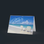 Sunny Beach With 2 Chairs Christmas Card<br><div class="desc">Warm Christmas wishes from the beach! A beautiful sunny beach with ocean waves crashing along the sand. There's 2 high back white beach chairs facing the ocean. Across the front it reads,  "Merry Christmas". Check out the many design & styles in our store.</div>