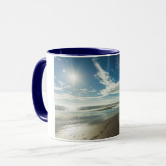 Sunny day over a winter beach mug
