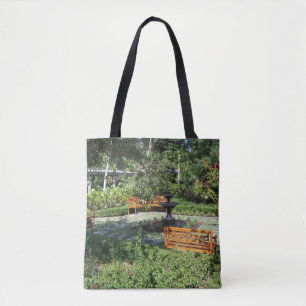 Sunny garden and fountain on a tote bag