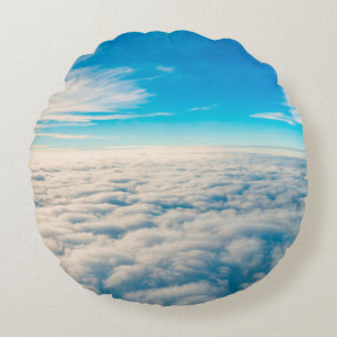 Sunrise above clouds from aeroplane window round cushion