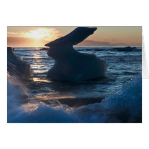 Sunrise and iceberg formation on the beach
