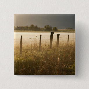 Sunrise lights fog along fence near Charlo 15 Cm Square Badge