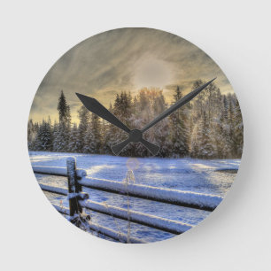 Sunrise on a Winter Pasture in Snow Round Clock