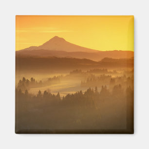 Sunrise orange colours the fog in the valley in magnet
