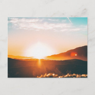 sunrise over a mountain postcard