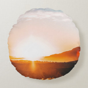 sunrise over a mountain round cushion