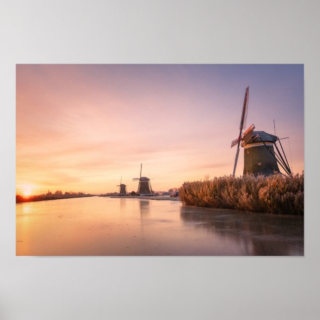 Sunrise over frozen river with windmills and reeds poster (Front)