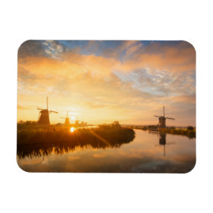 Sunrise over windmills and a river in Holland Magnet