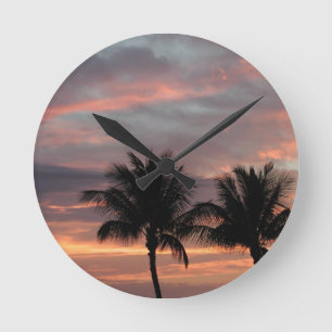 Sunset and palm trees round clock