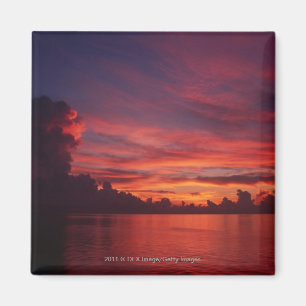 Sunset at sea with dark clouds magnet
