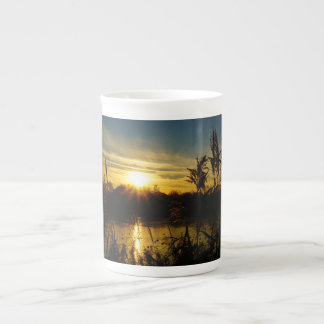 Sunset by a small lake with reed plumes. bone china mug
