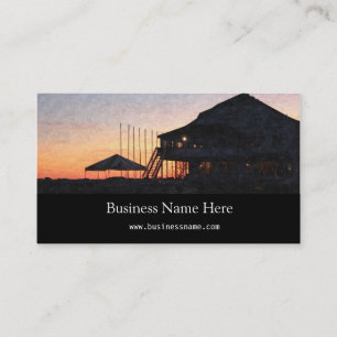 sunset by the lake waterfront with deck buildings business card