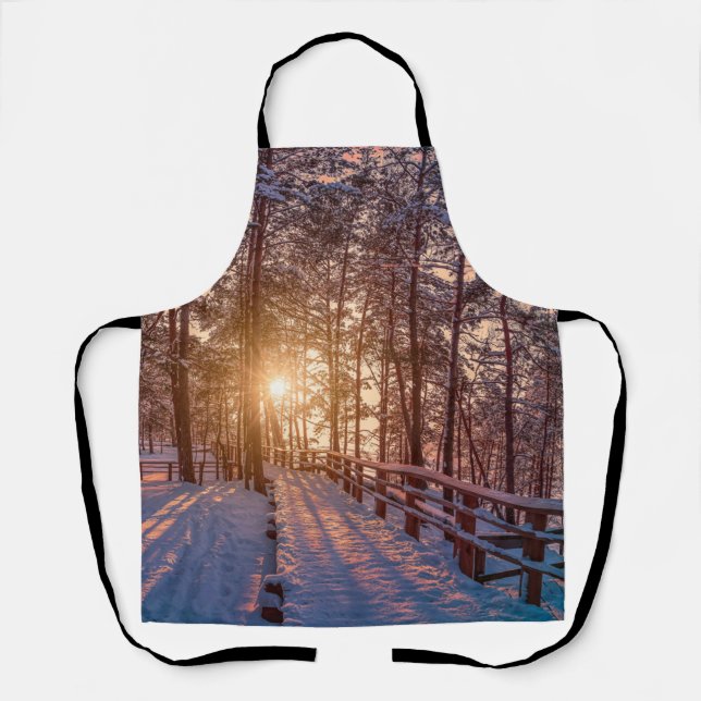 Sunset in snowy pine forest with sun ray apron (Front)
