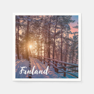 Sunset in snowy pine forest with sun ray napkin