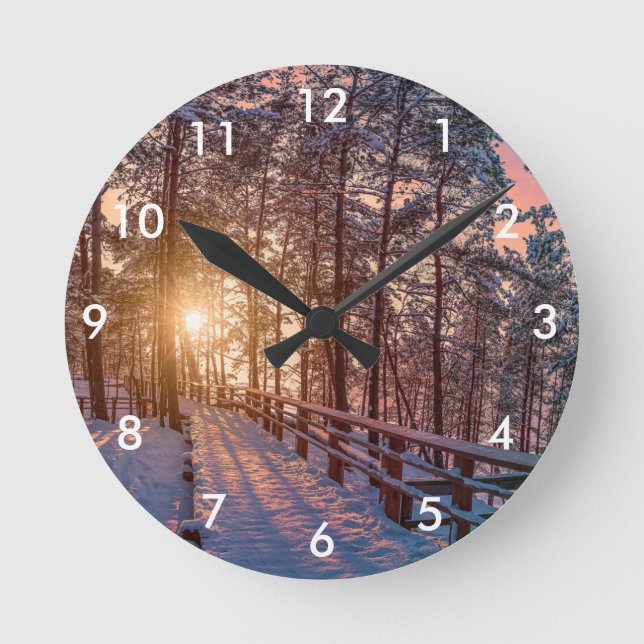Sunset in snowy pine forest with sun ray round clock (Front)