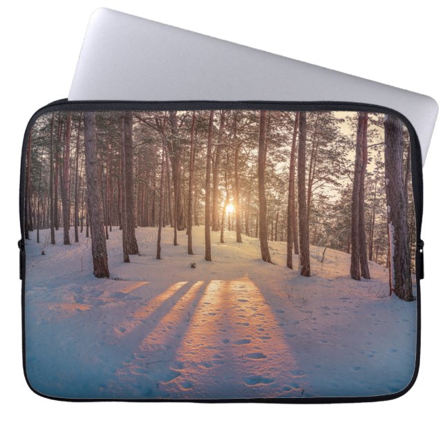 Sunset in snowy winter pine forest laptop sleeve (Front)