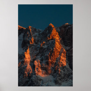 Sunset light on majestic mountains poster
