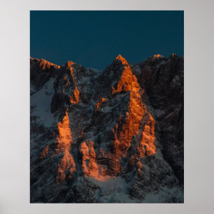 Sunset light on majestic mountains poster