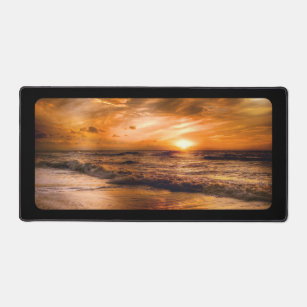 Sunset on a deserted beach desk mat