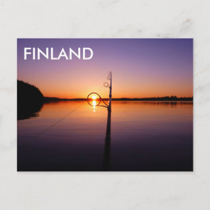 Sunset on a summer lake seen through a fishing rod postcard