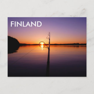 Sunset on a summer lake seen through a fishing rod postcard