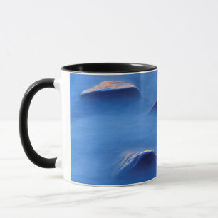Sunset on rocks protruding through foamy water mug