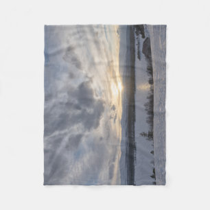 Sunset over frozen lake fleece blanket