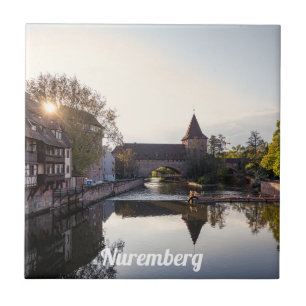 Sunset over old mediaeval bridge in Nuremberg Ceramic Tile