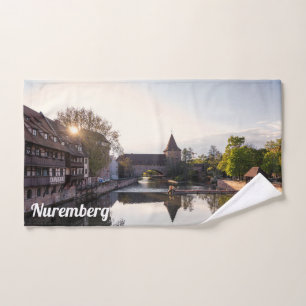 Sunset over old mediaeval bridge in Nuremberg Hand Towel