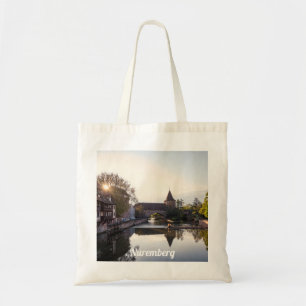 Sunset over old mediaeval bridge in Nuremberg Tote Bag