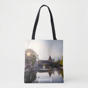 Sunset over old medieval bridge in Nuremberg Tote Bag