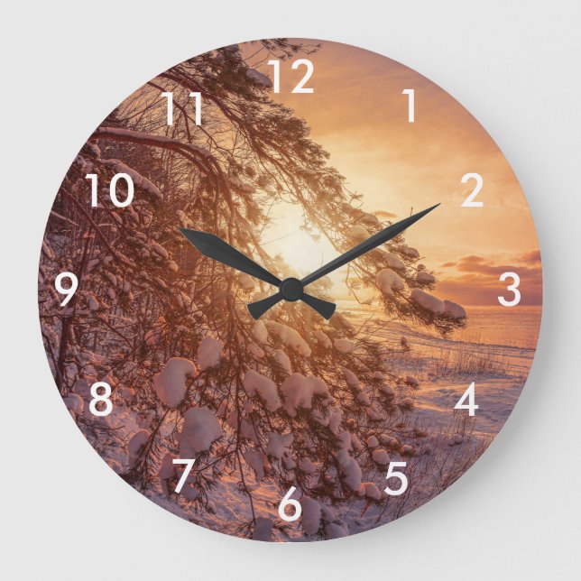 Sunset over sea and snowy pine tree large clock (Front)