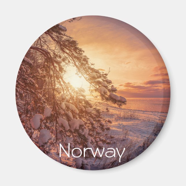 Sunset over sea and snowy pine tree magnet (Front)