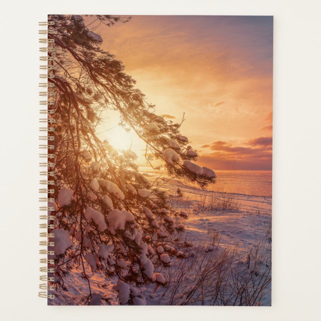 Sunset over sea and snowy pine tree planner (Front)