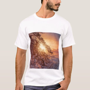 Sunset over sea and snowy pine tree T-Shirt